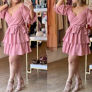 LIGHT PINK SHORT RUFFLE DRESS WITH BOW STRING ATTACHED SIZE SMALL FROM BOUTIQUE